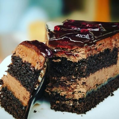 pexels-photo-291528-291528 Close-up of a rich chocolate cake slice with blueberry topping, perfect for dessert lovers.